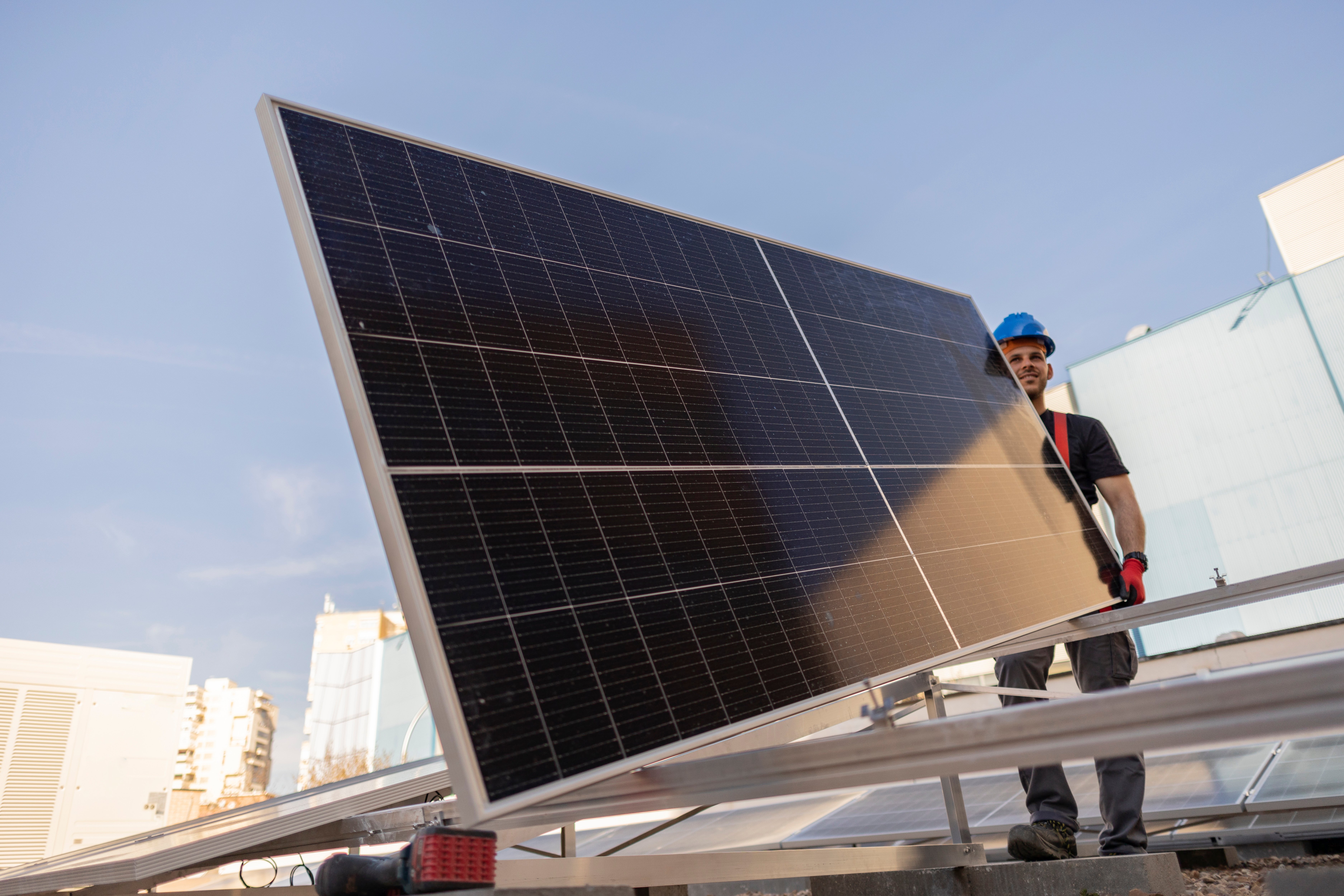 man-worker-installing-solar-photovoltaic-panels-on-2023-11-27-05-32-23-utc